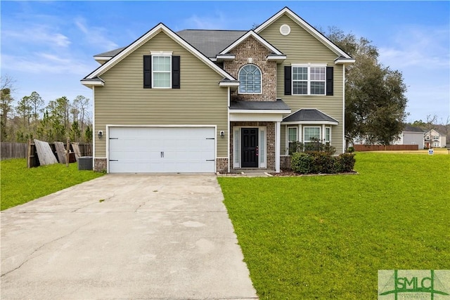 view of front of home with driveway, brick siding, a front yard, and fence