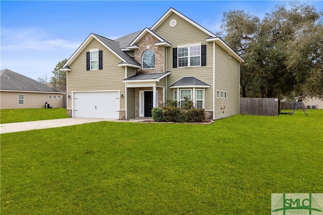 view of front of house with concrete driveway, a front yard, a garage, and fence