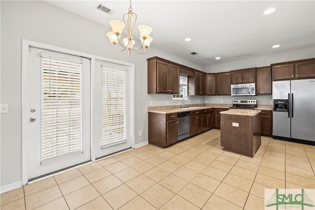 kitchen featuring visible vents, dark brown cabinets, appliances with stainless steel finishes, an inviting chandelier, and light tile patterned flooring