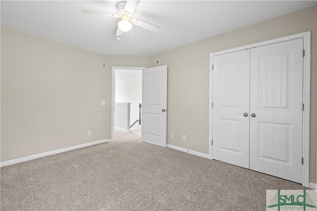 unfurnished bedroom featuring a closet, carpet flooring, ceiling fan, and baseboards