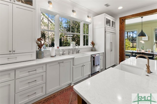 kitchen featuring a sink, white cabinetry, glass insert cabinets, and stainless steel dishwasher