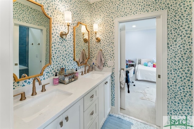 bathroom with wallpapered walls, ensuite bath, and a sink