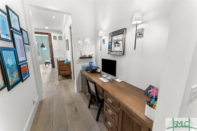 office area with recessed lighting, baseboards, and light wood finished floors