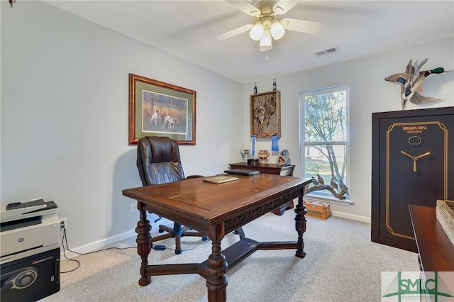 office area featuring visible vents, baseboards, light colored carpet, and ceiling fan