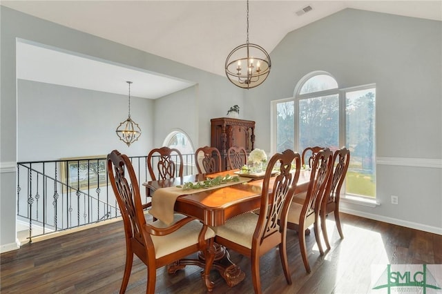 dining space featuring visible vents, an inviting chandelier, and wood finished floors