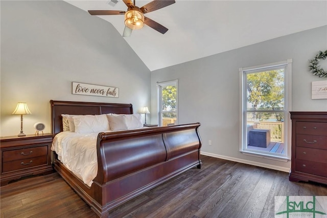 bedroom featuring dark wood finished floors, vaulted ceiling, a ceiling fan, and baseboards