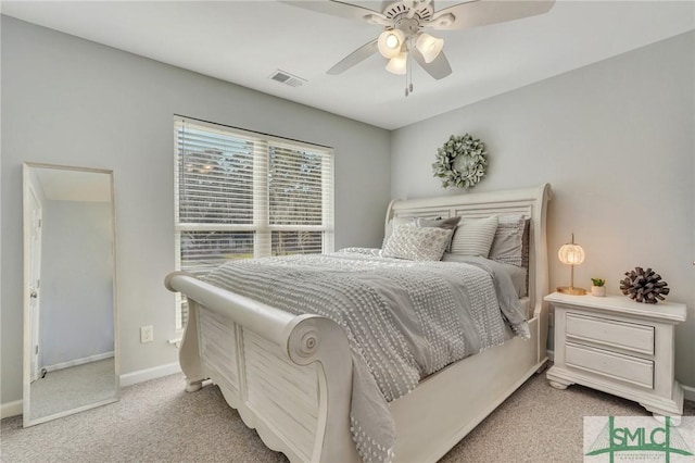 bedroom featuring visible vents, baseboards, carpet, and a ceiling fan