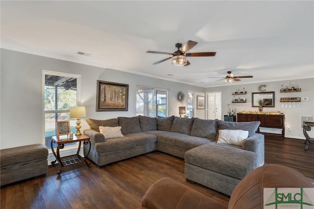 living room featuring visible vents, a healthy amount of sunlight, and wood finished floors