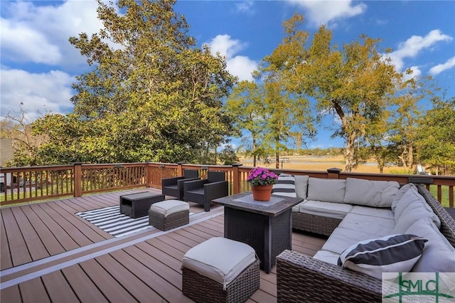 wooden terrace featuring an outdoor living space