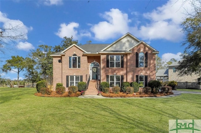 659 Harbour Ln, Richmond Hill, GA 31324 - bi-level home with brick siding and a front lawn