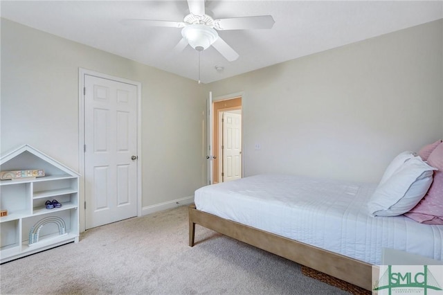 carpeted bedroom featuring a ceiling fan and baseboards