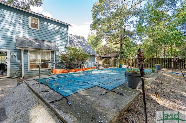 view of pool with a patio, fence, and a fenced in pool