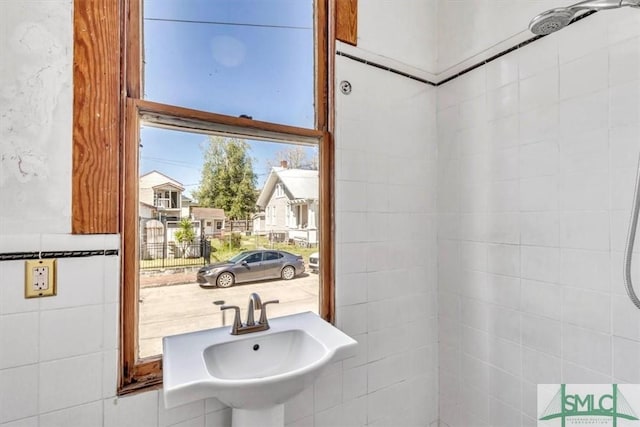 bathroom with a residential view and a sink