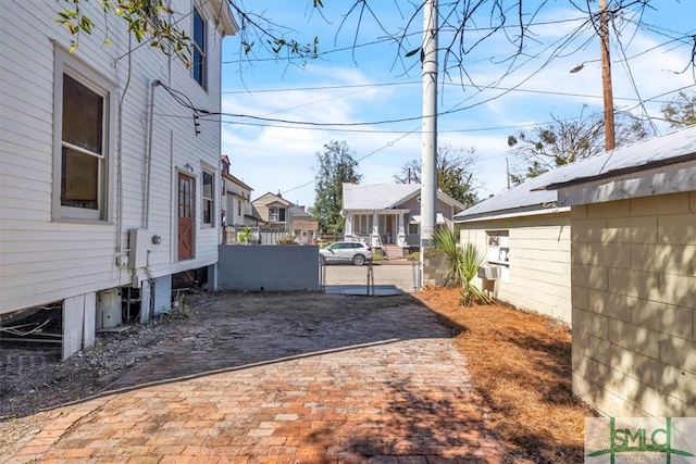 view of yard featuring a residential view and fence