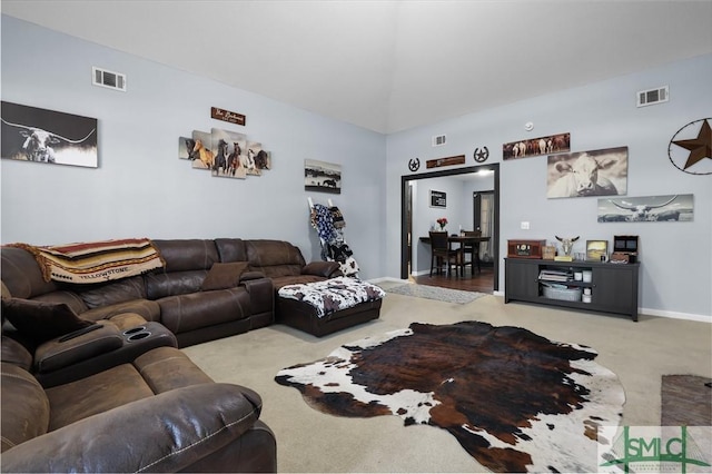 living area featuring visible vents, baseboards, and carpet flooring