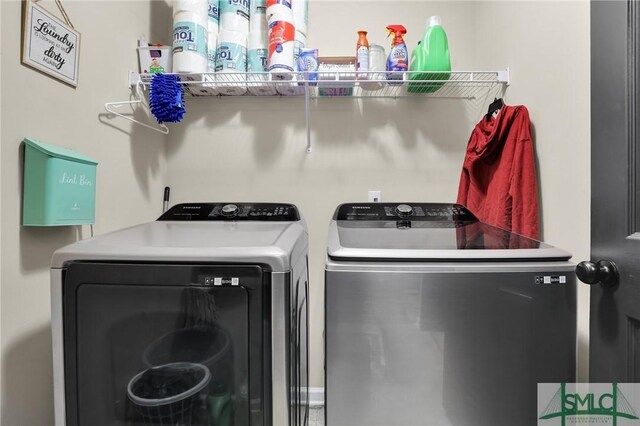 clothes washing area with laundry area and washing machine and dryer