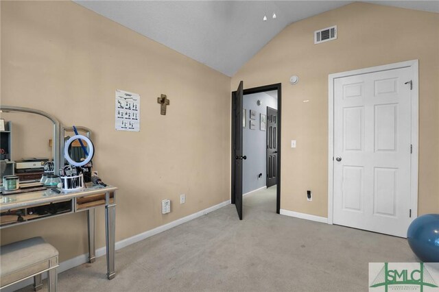 office space with visible vents, lofted ceiling, baseboards, and carpet flooring