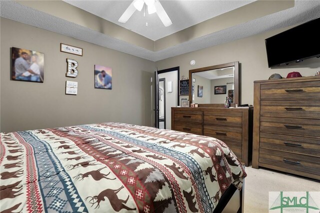 bedroom with light carpet and ceiling fan