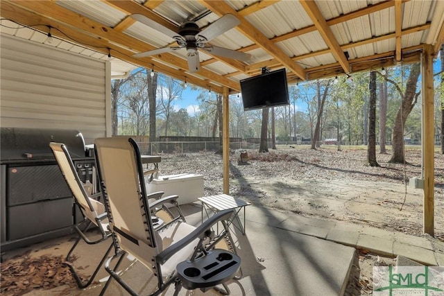 view of patio with a ceiling fan and fence