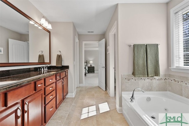 bathroom with visible vents, double vanity, a sink, tile patterned flooring, and a garden tub