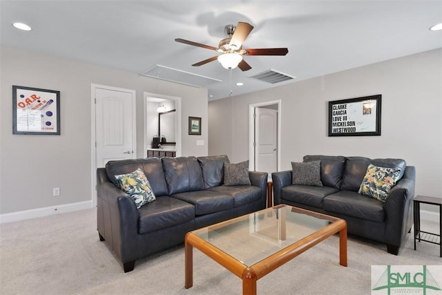 living room with visible vents, recessed lighting, baseboards, light colored carpet, and attic access