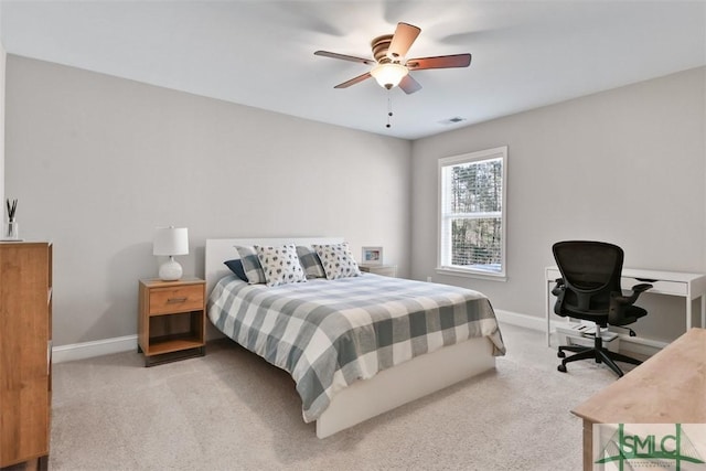 carpeted bedroom featuring baseboards, visible vents, and ceiling fan