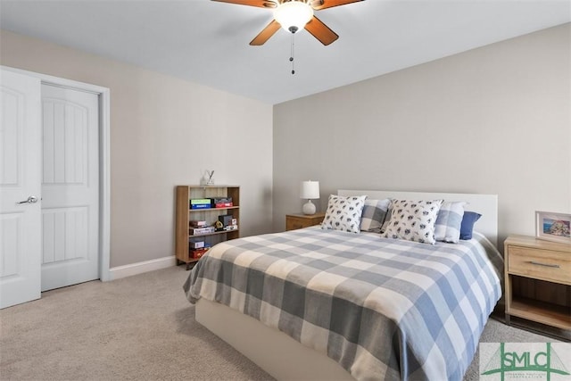 bedroom featuring carpet flooring, a ceiling fan, and baseboards