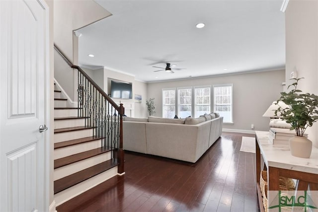 living area featuring recessed lighting, stairway, crown molding, baseboards, and dark wood-style flooring