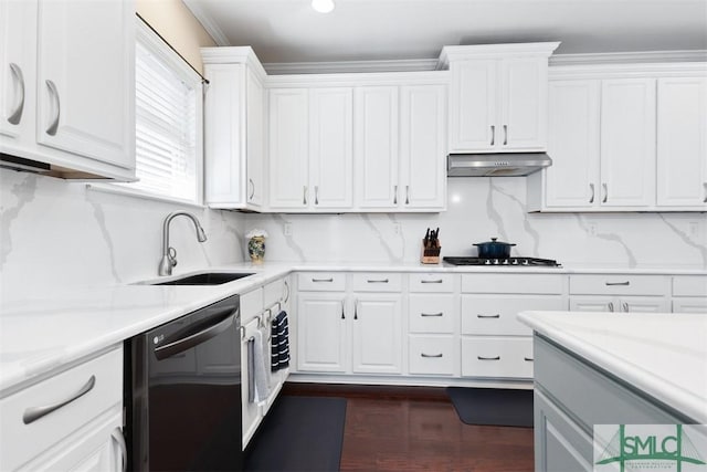 kitchen featuring under cabinet range hood, dishwasher, black cooktop, white cabinets, and a sink