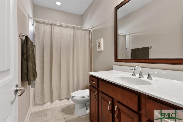 bathroom with vanity, tile patterned floors, toilet, and shower / bath combo with shower curtain