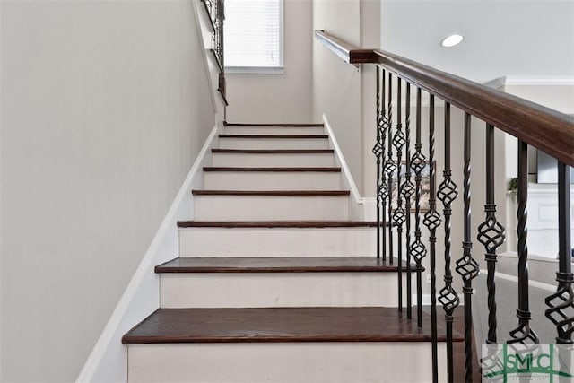 stairs with recessed lighting and baseboards