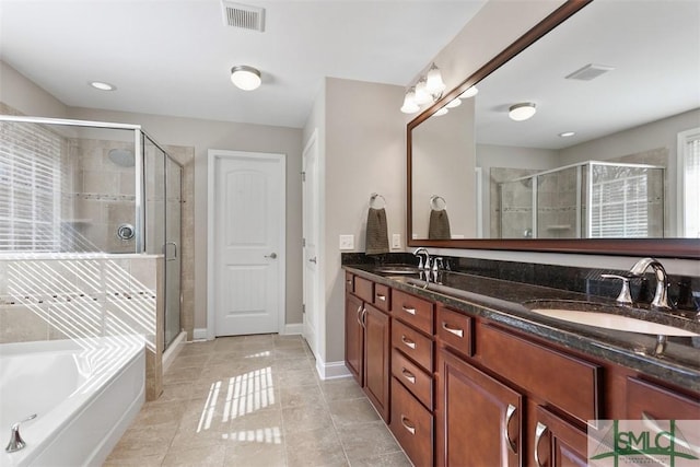 full bathroom featuring a sink, visible vents, and a shower stall