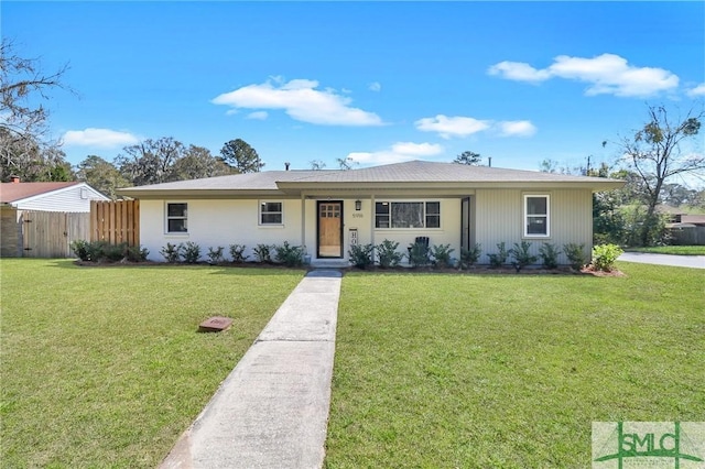 ranch-style house with a front yard and fence