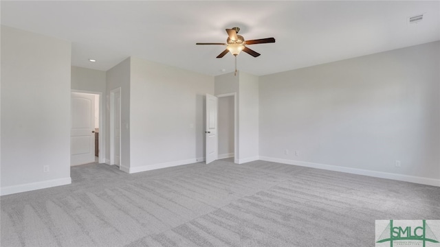 unfurnished bedroom with visible vents, a ceiling fan, carpet, and baseboards