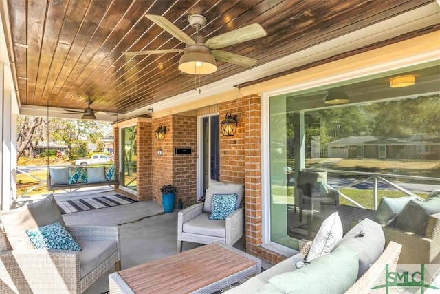 view of patio featuring an outdoor living space and ceiling fan