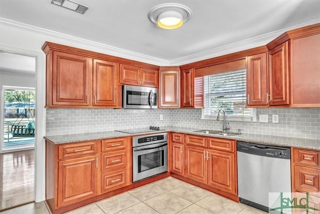 kitchen with a healthy amount of sunlight, visible vents, appliances with stainless steel finishes, and a sink