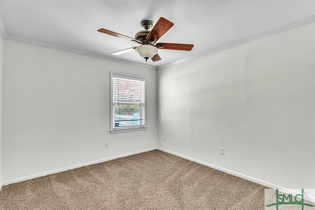 spare room with crown molding, carpet flooring, baseboards, and ceiling fan