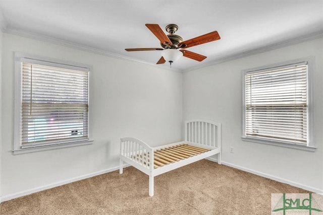 unfurnished bedroom featuring baseboards, carpet, and ornamental molding