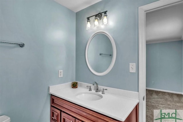 bathroom with vanity and crown molding