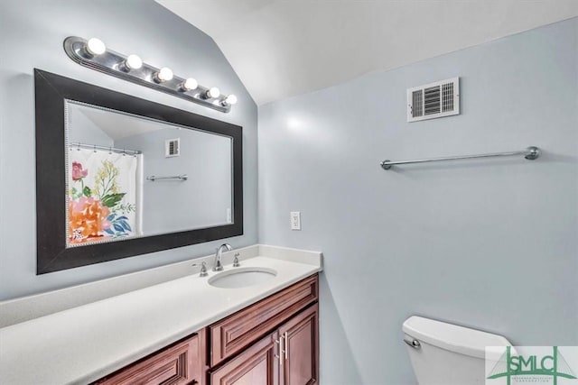 full bath featuring visible vents, toilet, vanity, and lofted ceiling