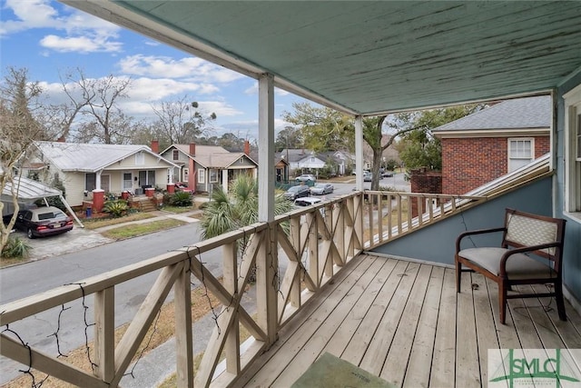 wooden deck featuring a residential view