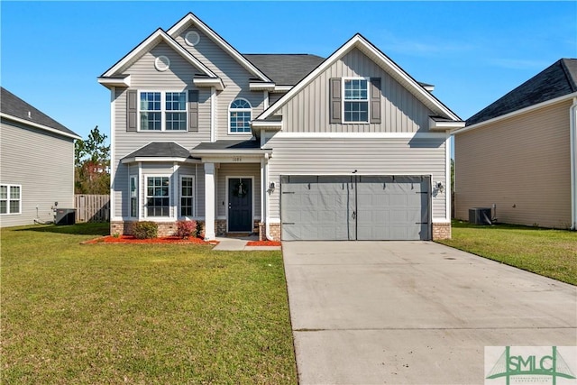 view of front facade with a front yard, concrete driveway, a garage, board and batten siding, and brick siding