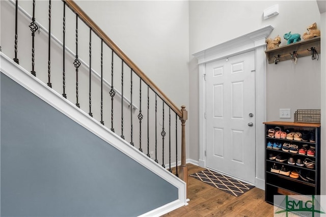 entrance foyer with stairway and wood finished floors