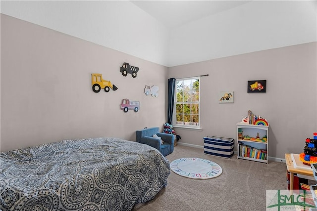 bedroom featuring carpet and baseboards