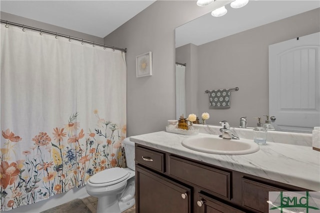 bathroom with toilet, vanity, and a shower with curtain