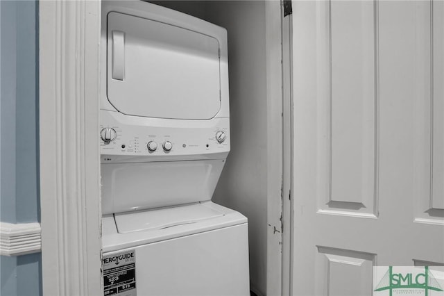 laundry room featuring laundry area and stacked washing maching and dryer