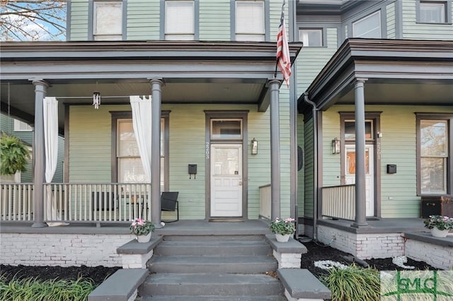 property entrance with covered porch