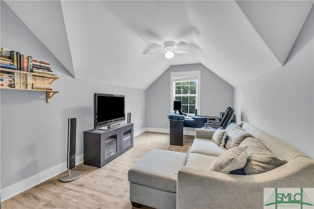 living room with ceiling fan, baseboards, lofted ceiling, and wood finished floors