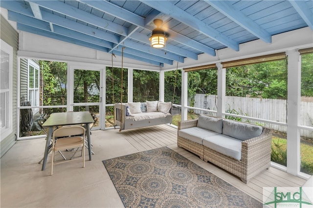 sunroom / solarium with beam ceiling, wood ceiling, and a healthy amount of sunlight