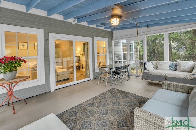 sunroom with beam ceiling